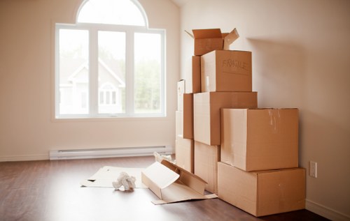 Professional movers loading items into a van in South Kensington