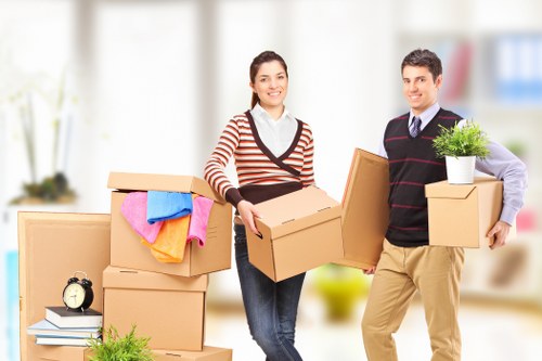 Professional movers packing delicate items in South Kensington