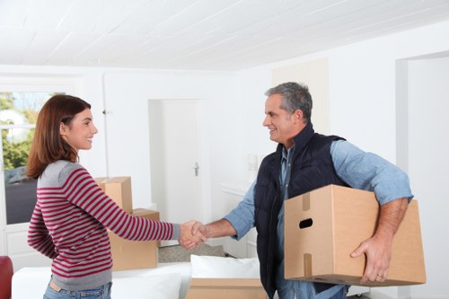 Careful loading of furniture with protective equipment in South Kensington